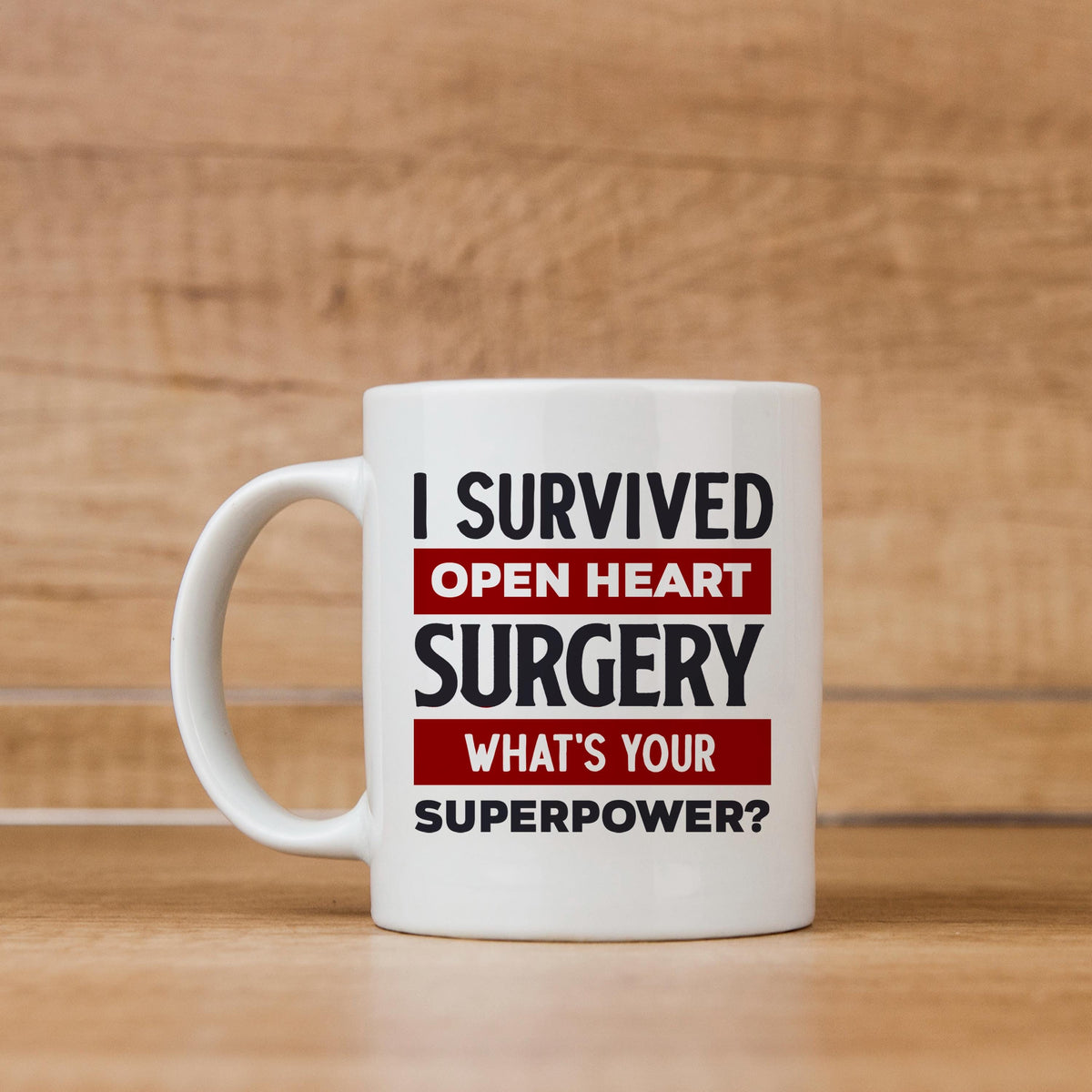 White coffee mug with red and black lettering: I Survived Open Heart Surgery, What’s Your Superpower?
