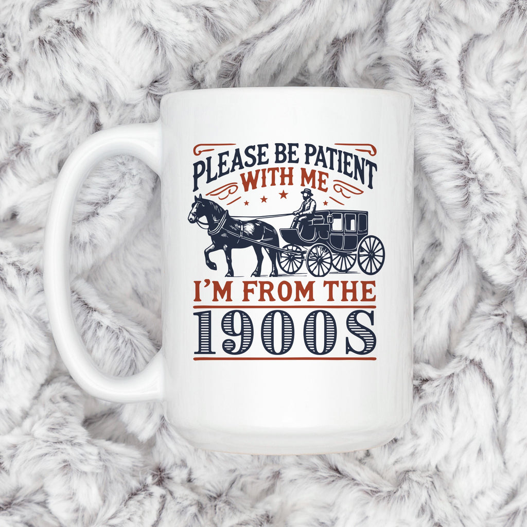 White ceramic mug with horse carriage graphic and “Please be patient with me” text.