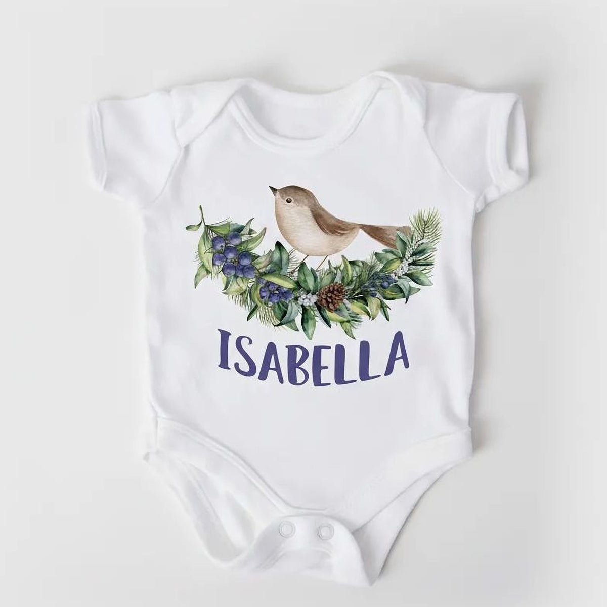 White short-sleeve baby bodysuit with bird on leafy wreath and 'ISABELLA' text