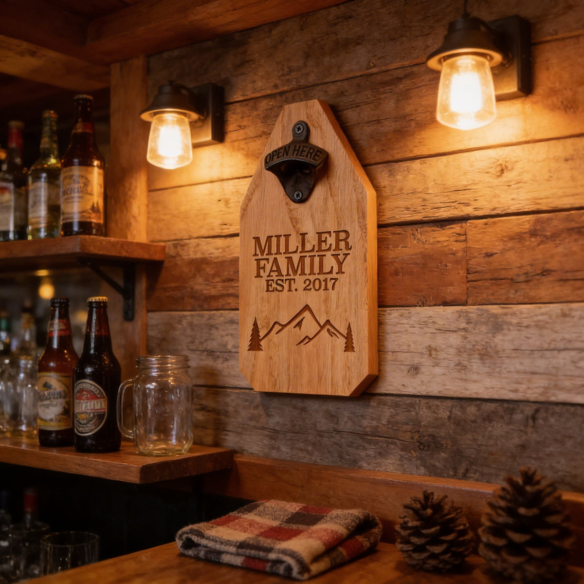 Engraved wood bottle opener sign with “Miller Family” and mountains, black opener hardware