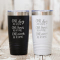 Black and white stainless steel tumblers with motivational “One day at a time” print