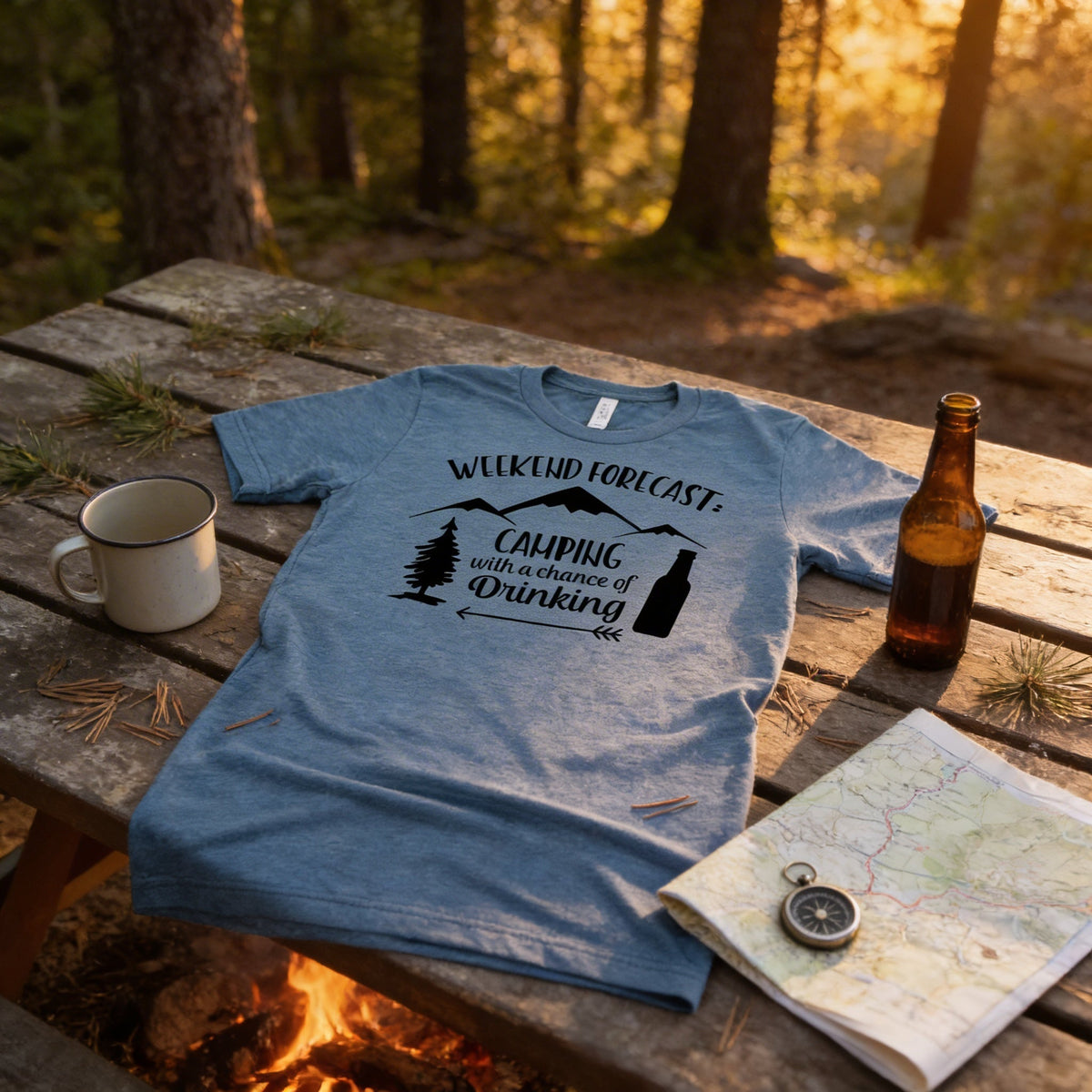 Light blue camping graphic t-shirt with “Weekend Forecast” cabin and “chance of Drinking”