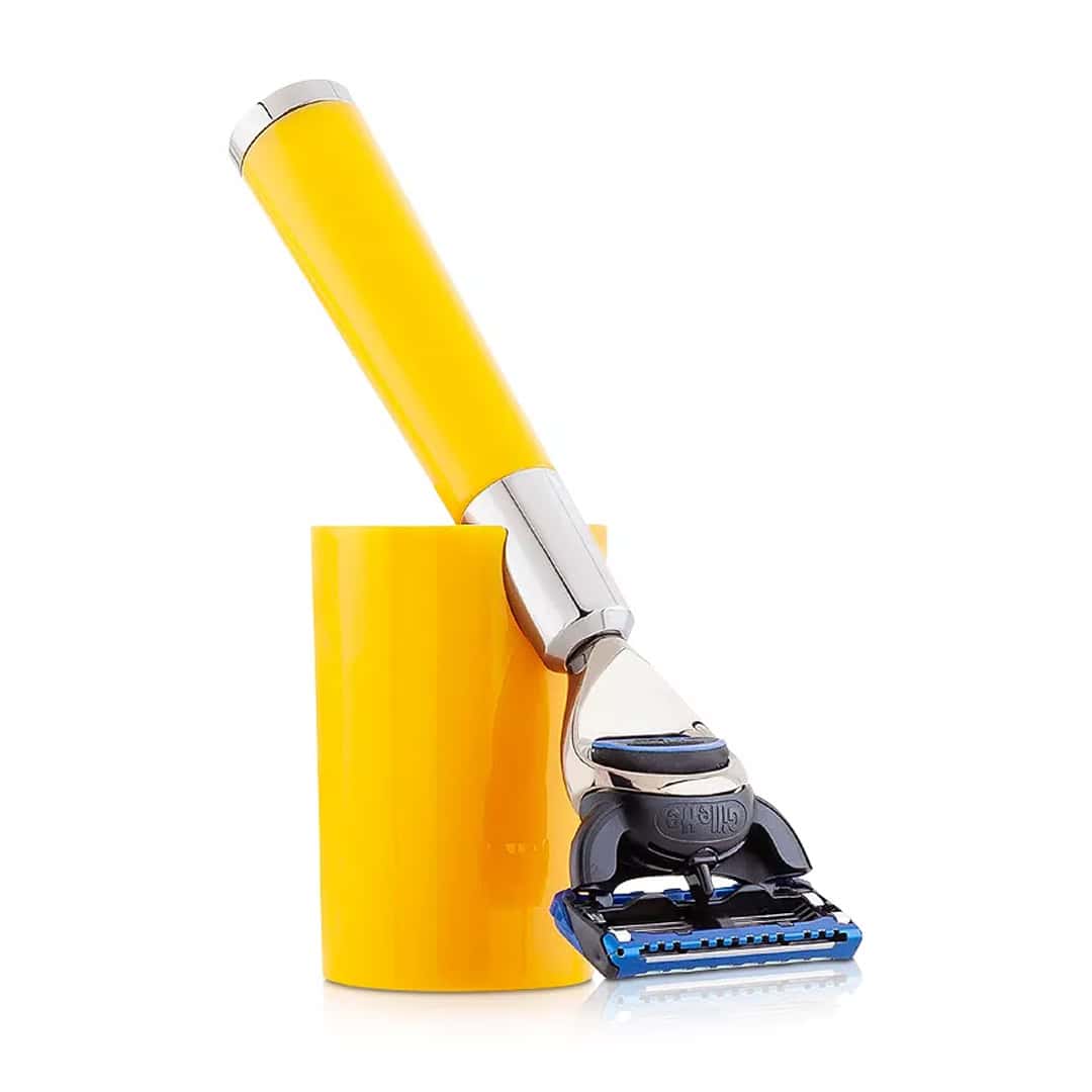 Yellow shaving razor with chrome head and black-and-blue cartridge