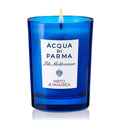 Acqua di Parma Mirto di Panarea candle in blue glass jar with label and flame