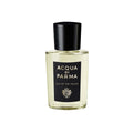 Eau de parfum bottle, black cap, clear glass, Lily of the Valley label