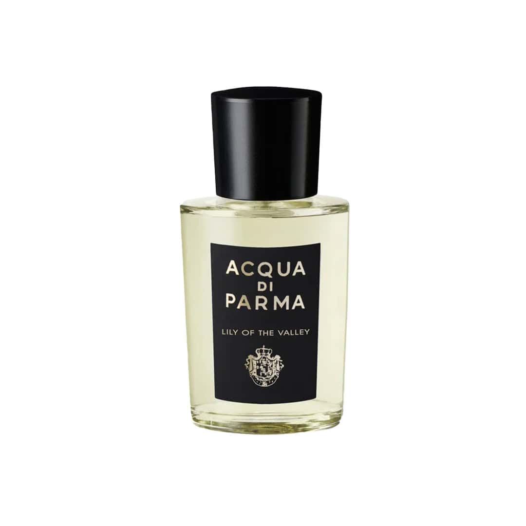 Eau de parfum bottle, black cap, clear glass, Lily of the Valley label