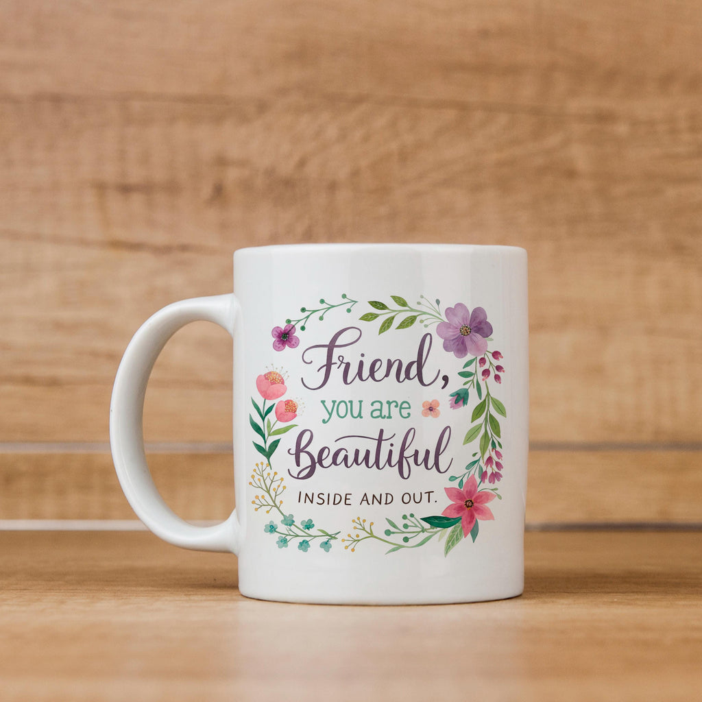 White mug with floral circle design and “Friend, you are Beautiful” message