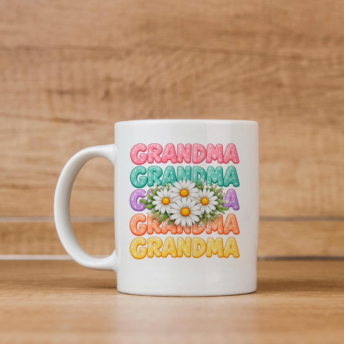 White ceramic coffee mug with Grandma text and daisy floral bouquet graphic