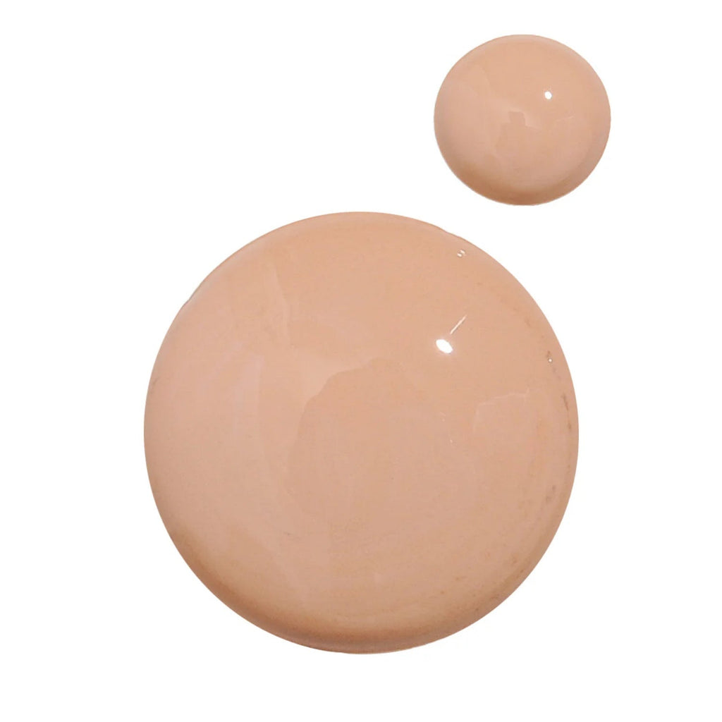 Tinted sunscreen swatch circles on skin