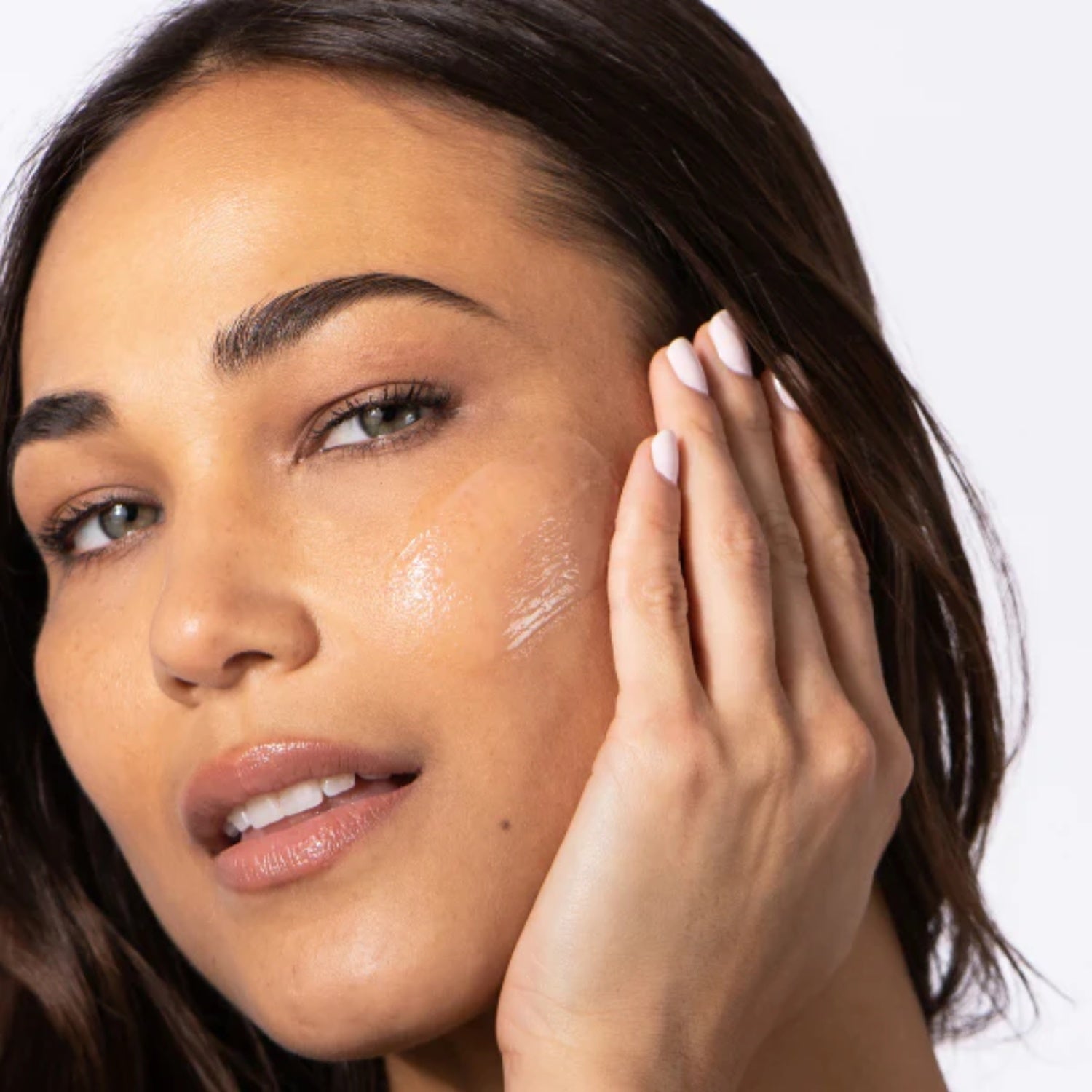 HA Immerse serum applied to face with a shiny layer