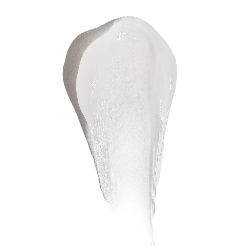 Thick white balm swatch with glossy, creamy texture