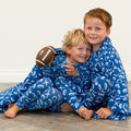 Blue kids pajama set with long sleeves and pants, white icon print