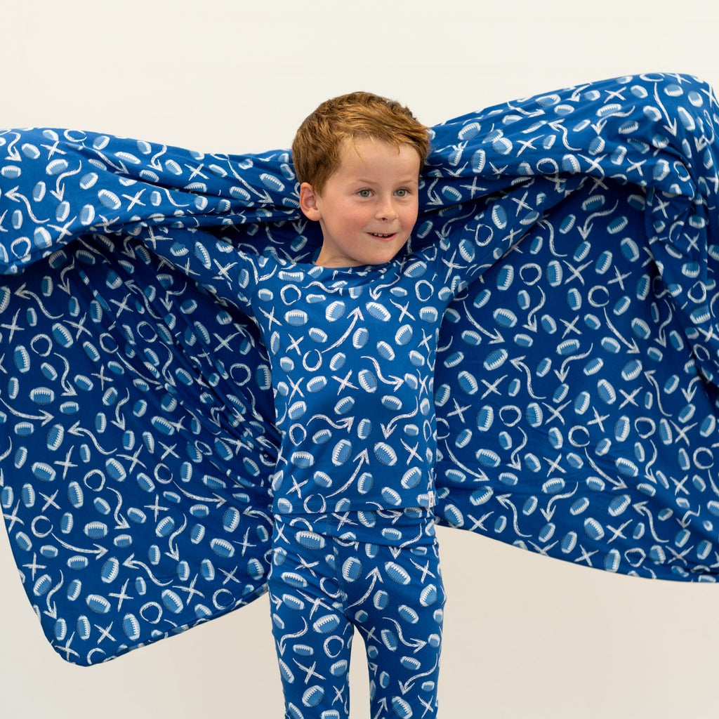 Blue kids pajama set with long sleeves and pants, white icon print