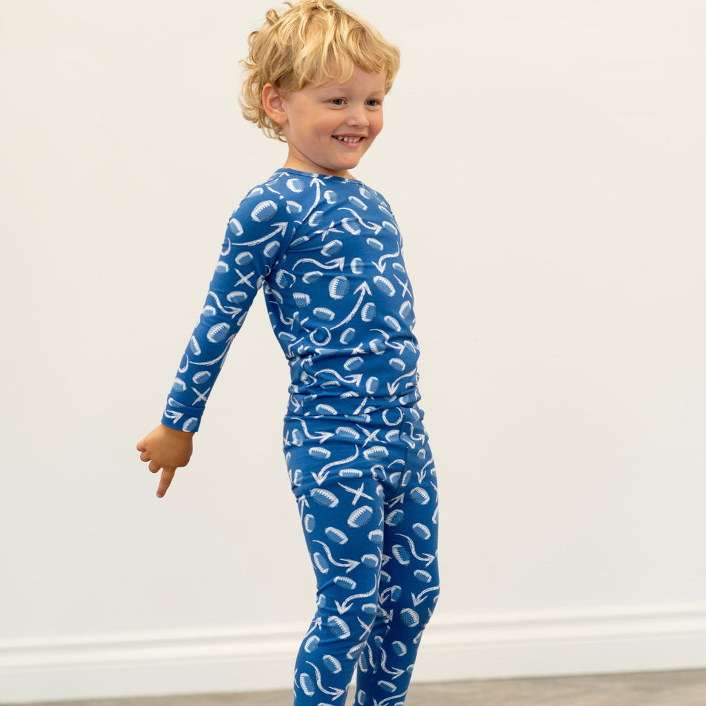 Blue kids pajama set with long sleeves and pants, white icon print