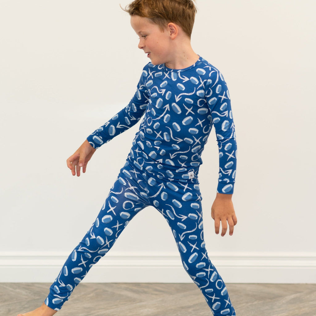 Blue kids pajama set with long sleeves and pants, white icon print