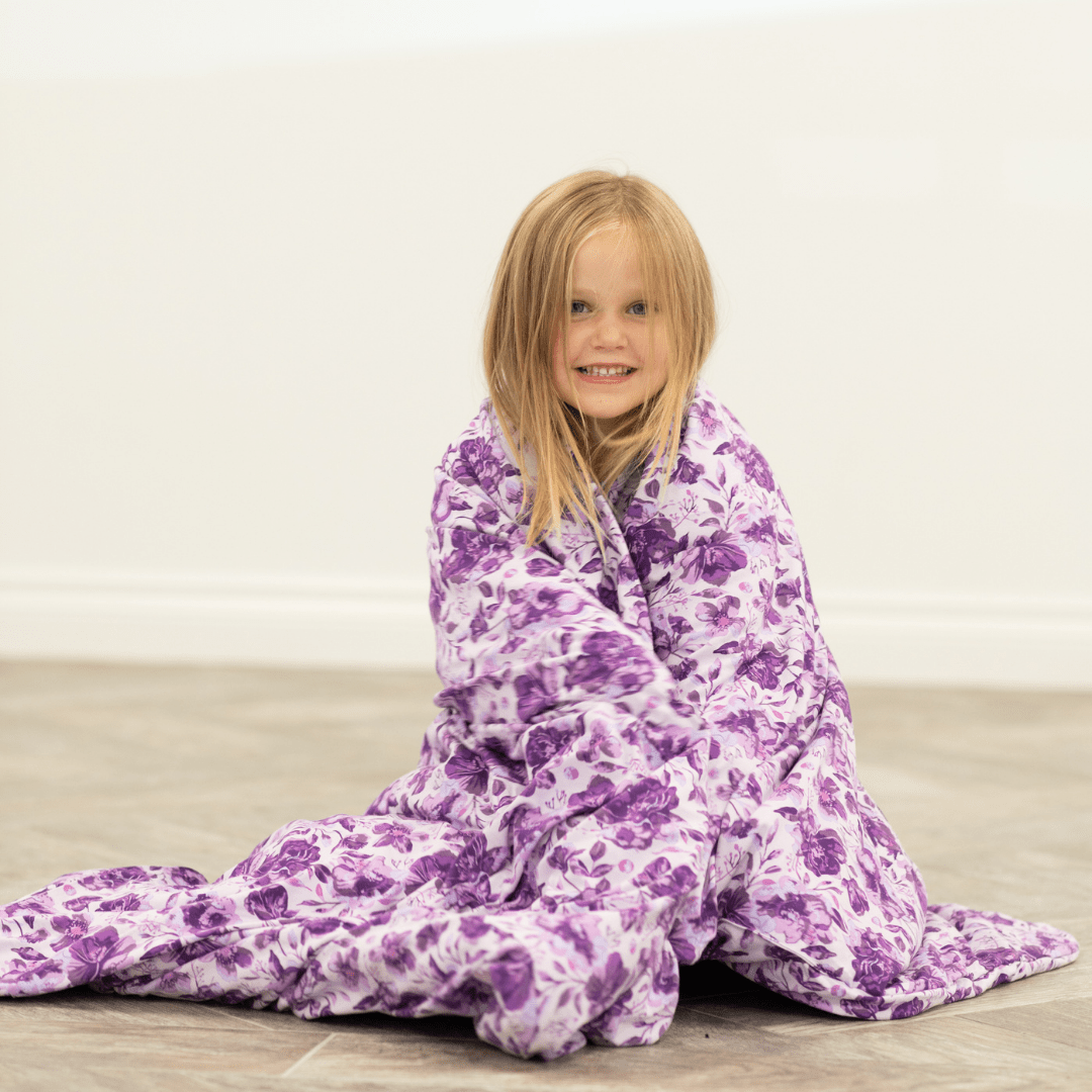 Purple floral cloud blanket with hooded opening