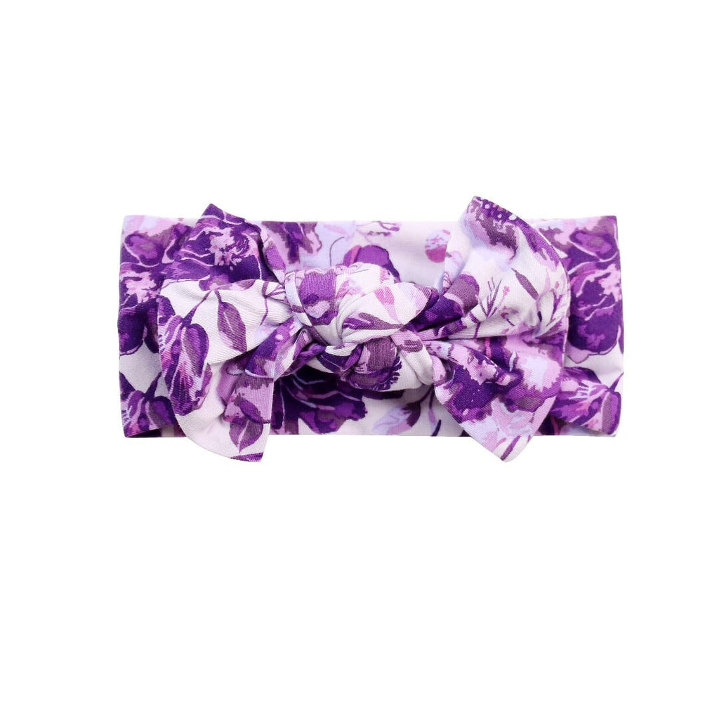 Knotted bow headband in purple floral print fabric