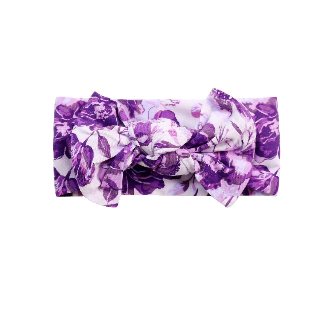 Knotted bow headband in purple floral print fabric