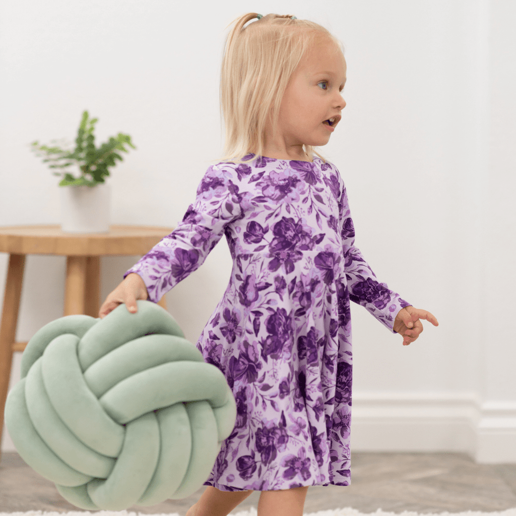 Girls purple floral long-sleeve dress, back view with gathered skirt
