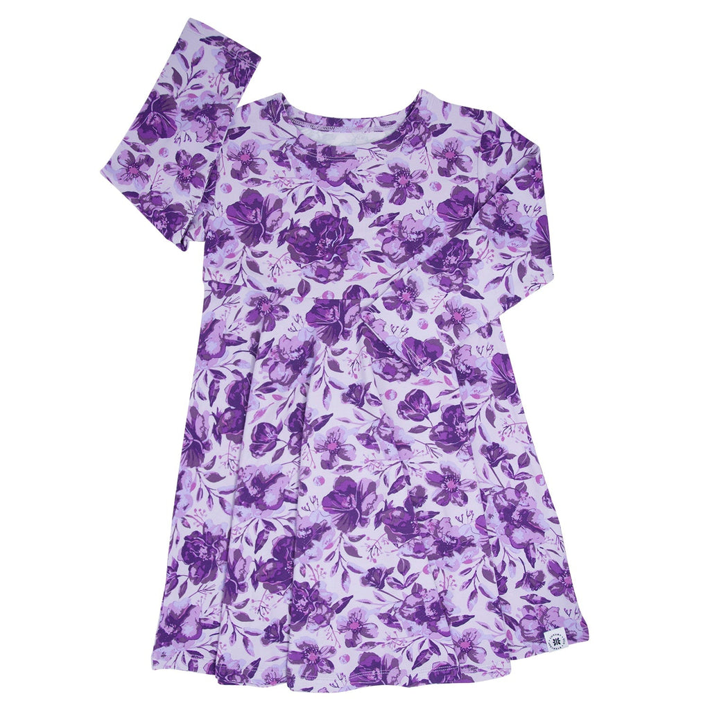 Purple floral long-sleeve girls dress with gathered skirt and round neckline, front view