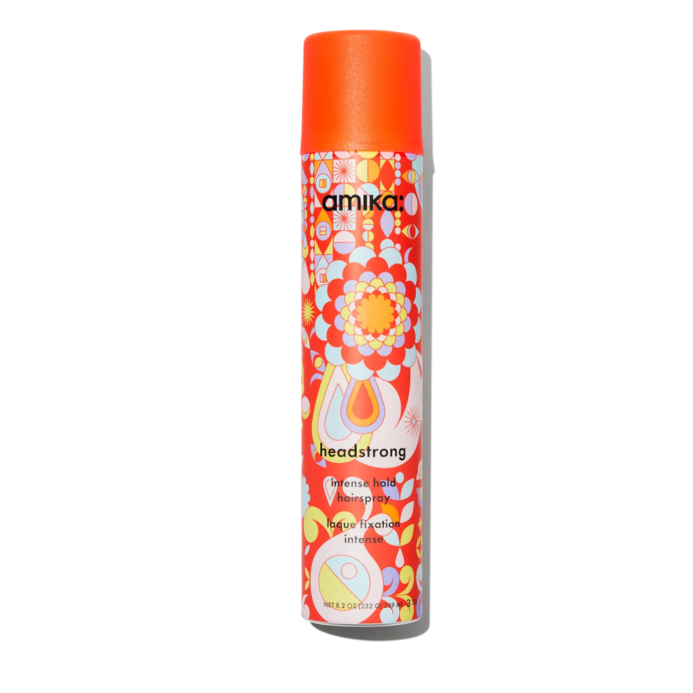 Amika hairspray bottle with orange cap and colorful floral label, intense hold