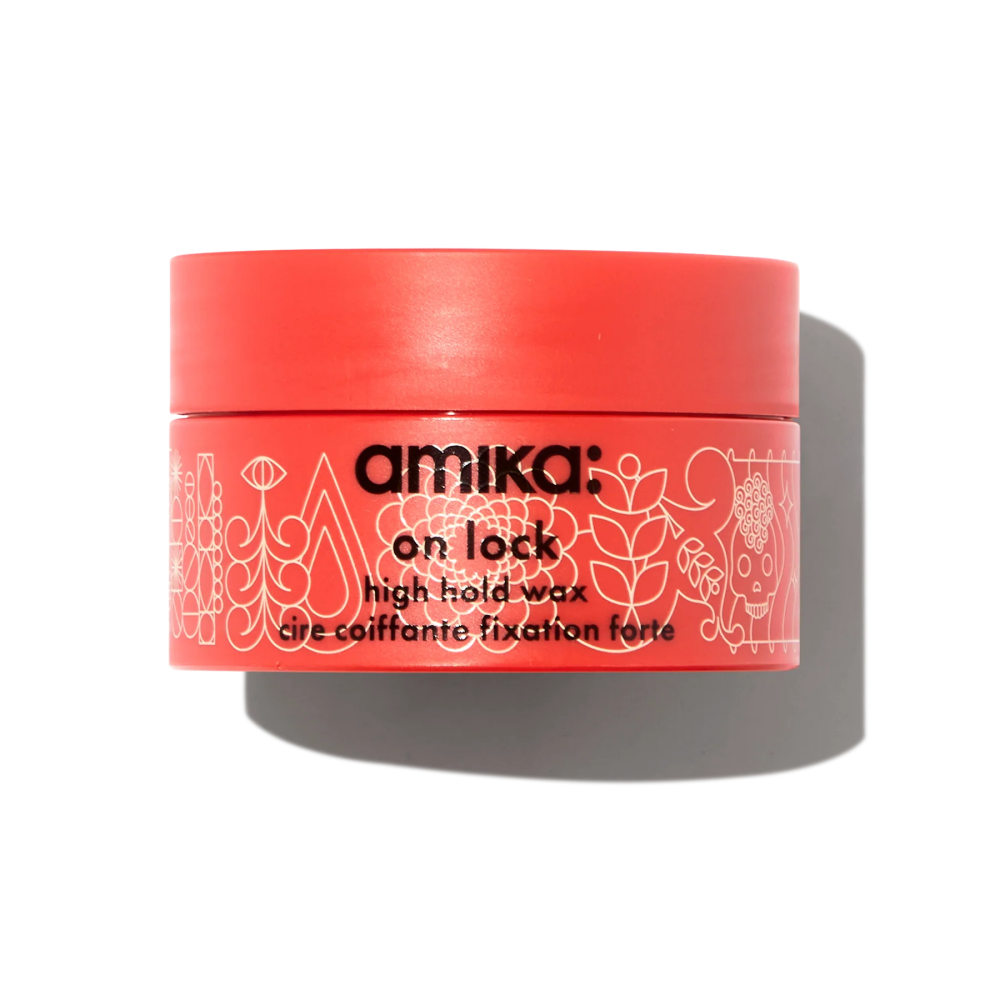 Amika On Lock high hold hair wax jar, coral pink plastic lid and label.