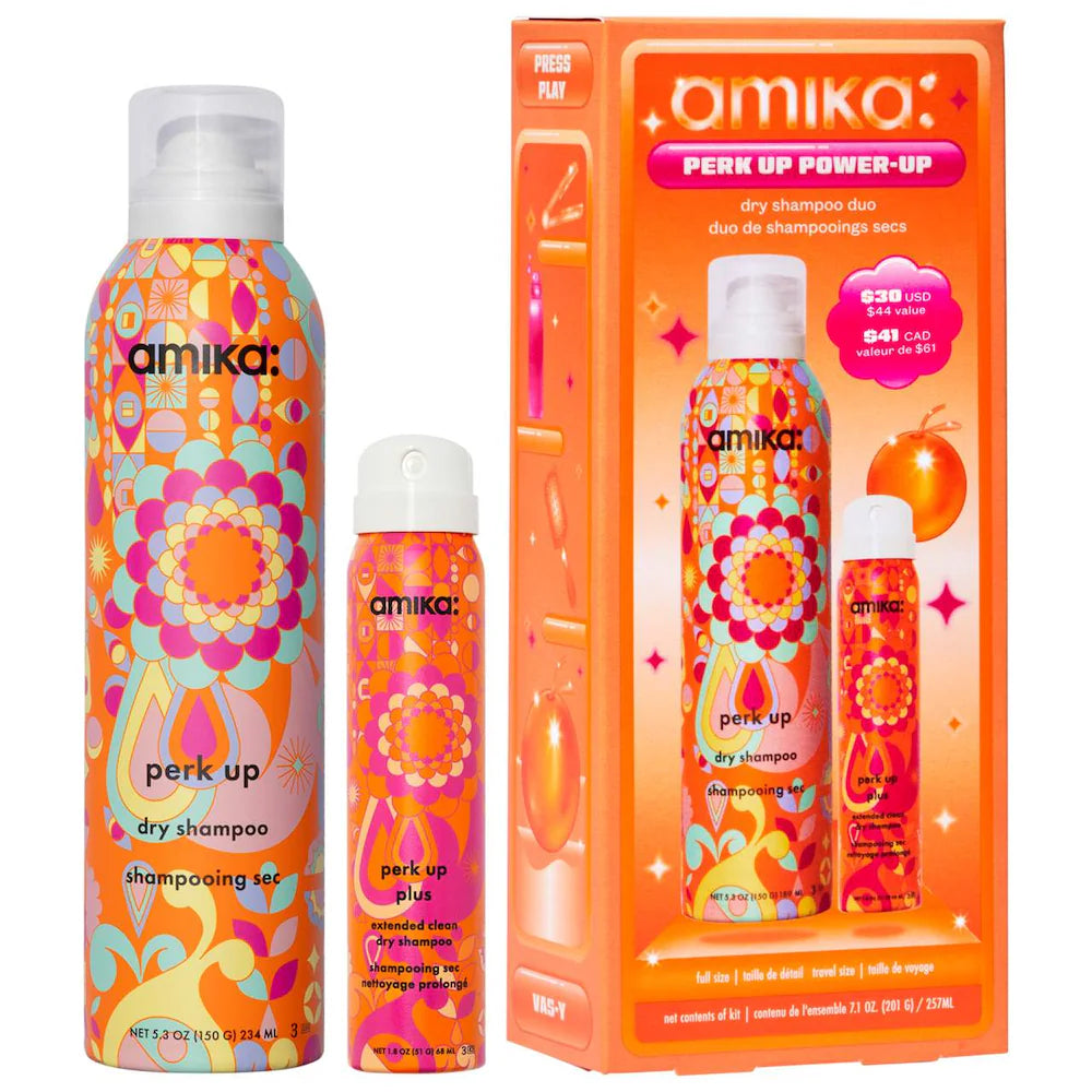 Amika perk up dry shampoo duo with colorful orange bottles and box packaging.