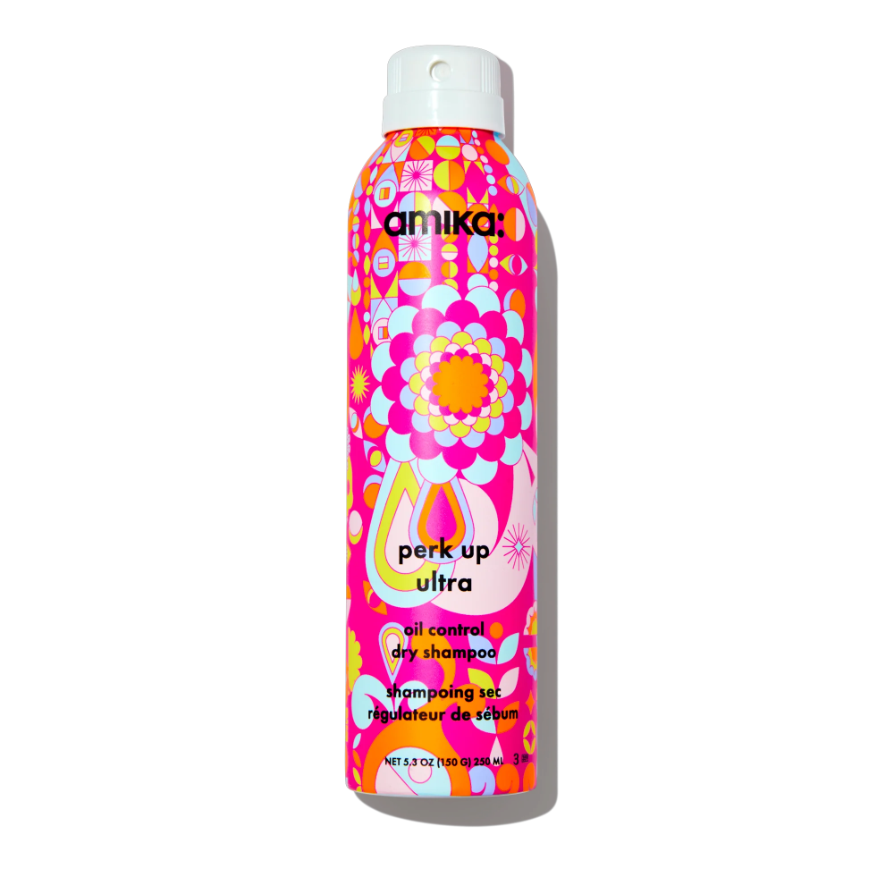 Amika dry shampoo bottle for oil control, pink and orange patterned label