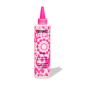 Amika scalp cleansing oil bottle with pink nozzle, pink floral label