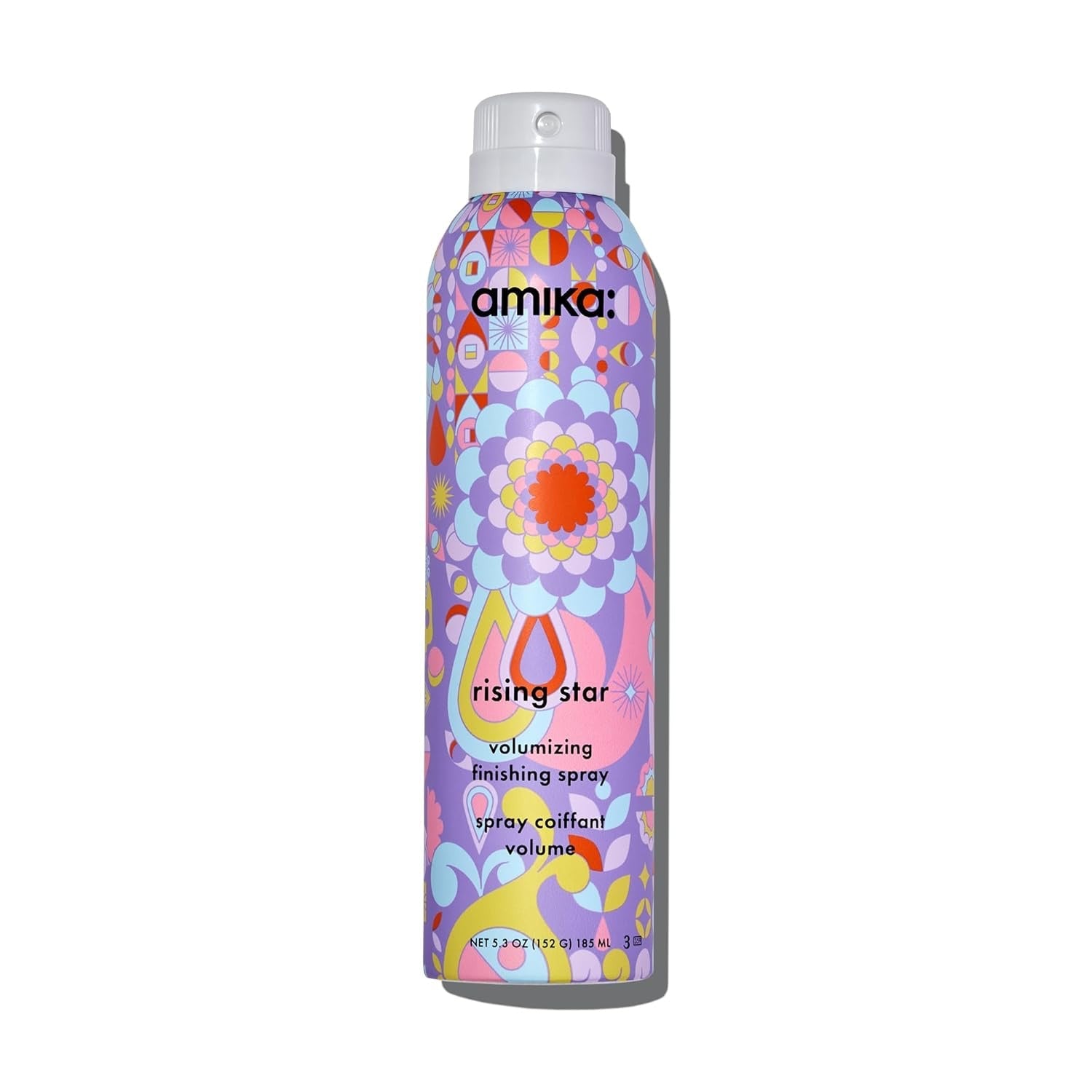Volumizing finishing spray bottle with colorful floral label, silver cap.