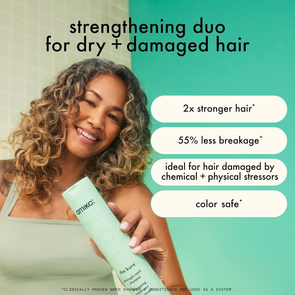 Amika the Kure conditioner bottle held near shoulder of smiling woman