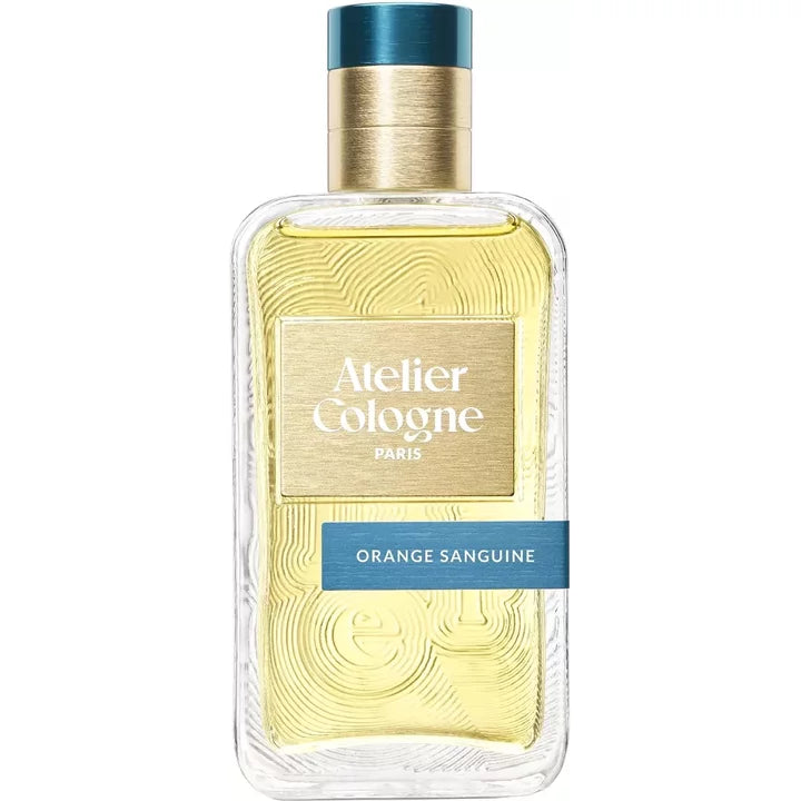 Atelier Cologne Orange Sanguine fragrance bottle, clear glass with gold cap and blue label