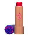 Tinted lip balm tube with red cap and blue side cap beside.
