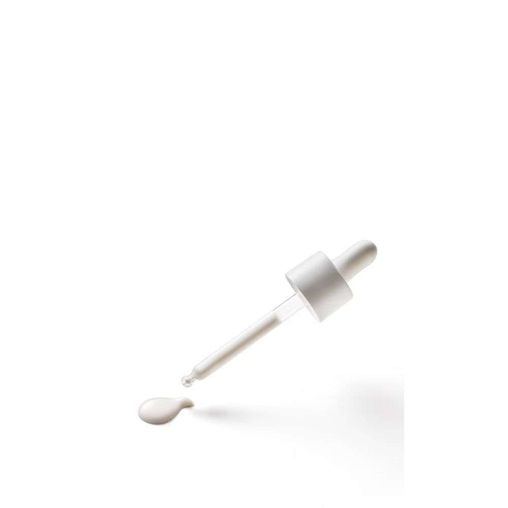 Dropper dispensing creamy serum from the nozzle