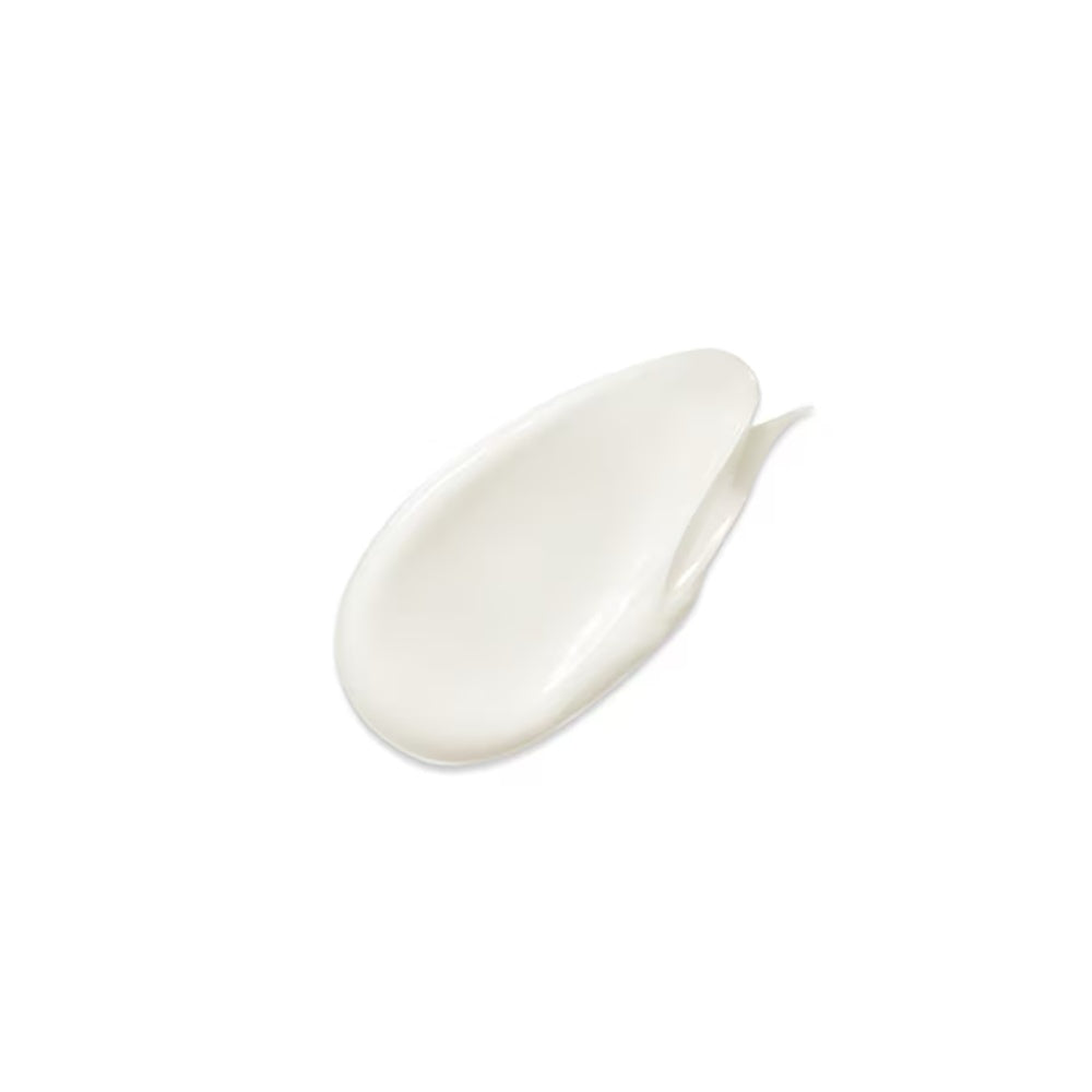 Conditioner cream swatch, white on a curved applicator scoop