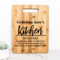 Bamboo cutting board with handle cutout, engraved 'Grandma Jane's Kitchen' text