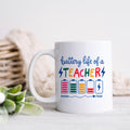 White ceramic mug with colorful “battery life of a TEACHER” battery graphic