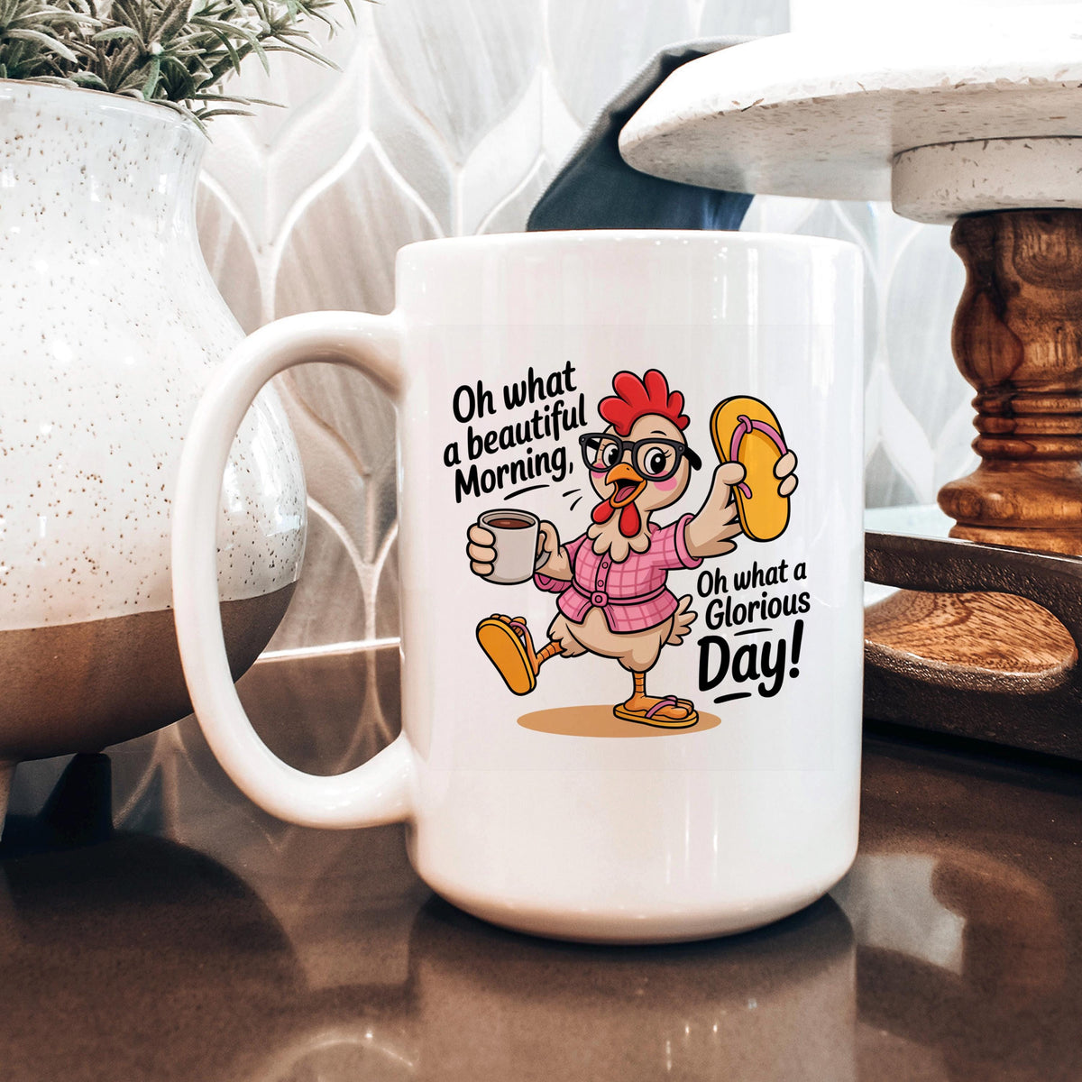 White ceramic coffee mug featuring a colorful chicken character with a cup graphic