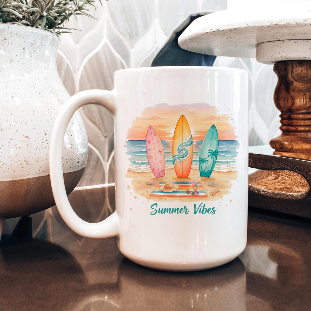 White ceramic mug with surfboard illustration and 'Summer Vibes' text on the front
