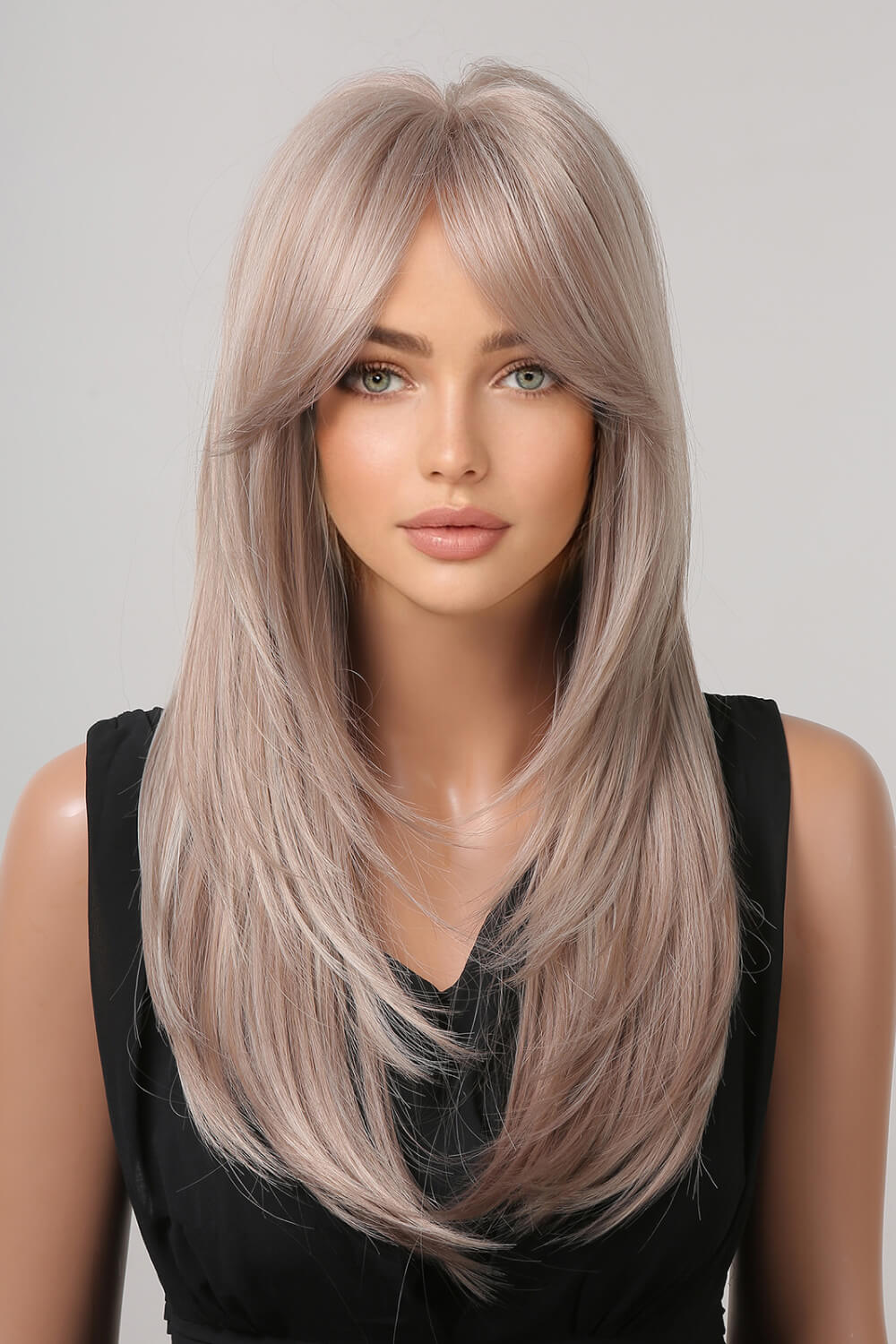 Long synthetic wig in light blonde, straight hair, center part, front view