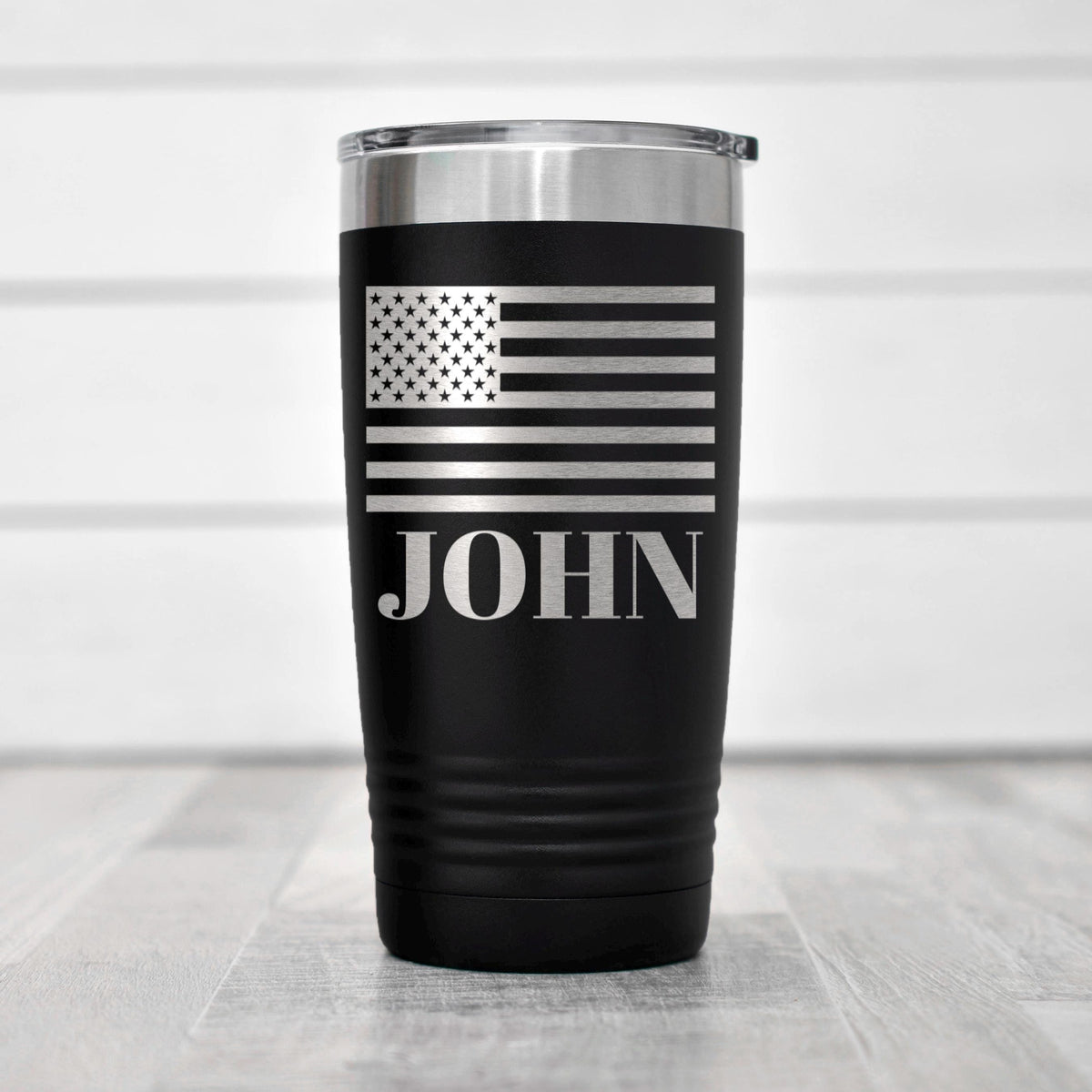 Insulated black tumbler with patriotic flag decal and 'JOHN' name