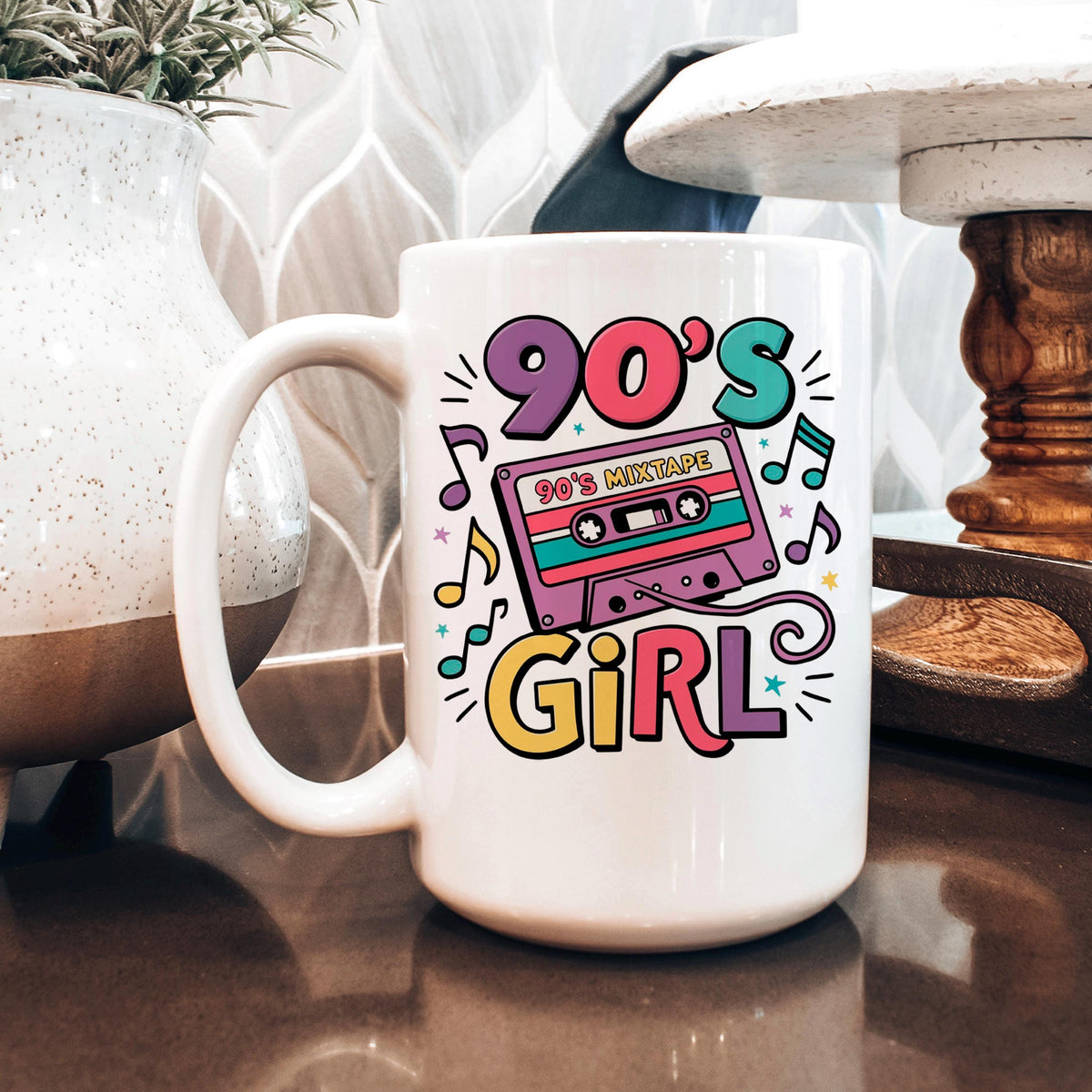 White ceramic mug with 90's Girl cassette tape graphic in bright colors