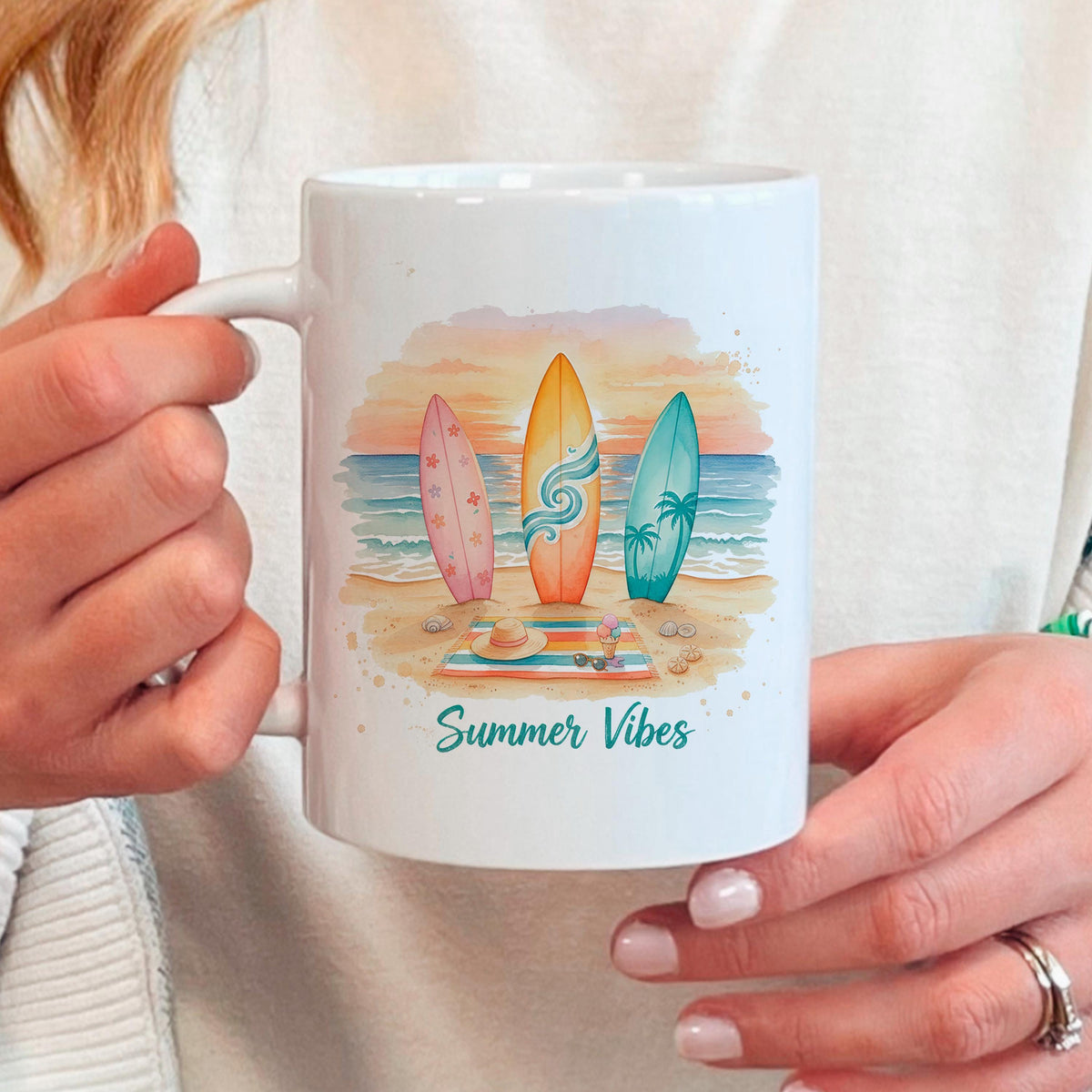 White ceramic mug with surfboards, ocean waves, sunset sky, and 'Summer Vibes' slogan