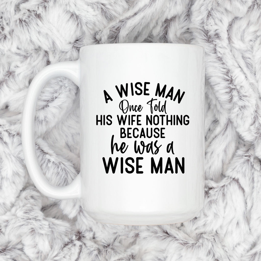 White ceramic coffee mug with "A WISE MAN" quote, front view with handle
