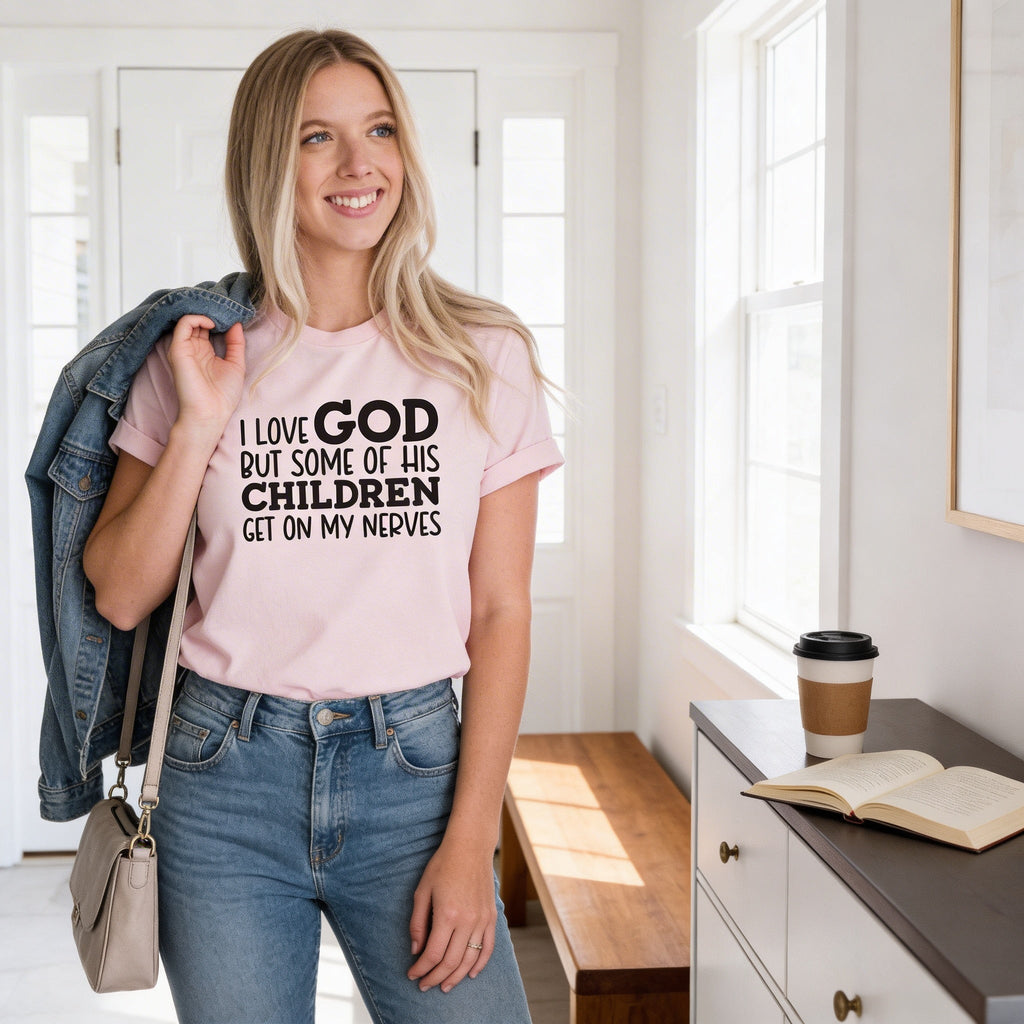 Light pink T-shirt with black “I LOVE GOD… CHILDREN” message, short sleeves, worn with jeans