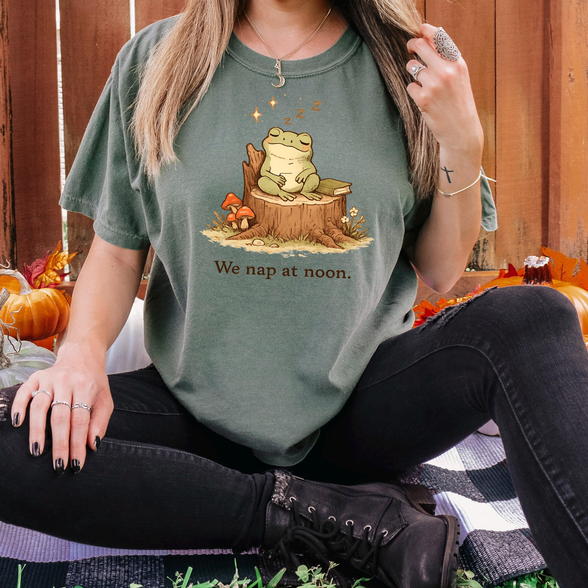 Dark green frog T-shirt with sleeping frog on stump and “We nap at noon.” print