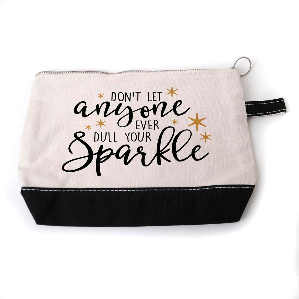 Beige canvas zippered cosmetic pouch with black bottom and 'anyone ... Sparkle' slogan.