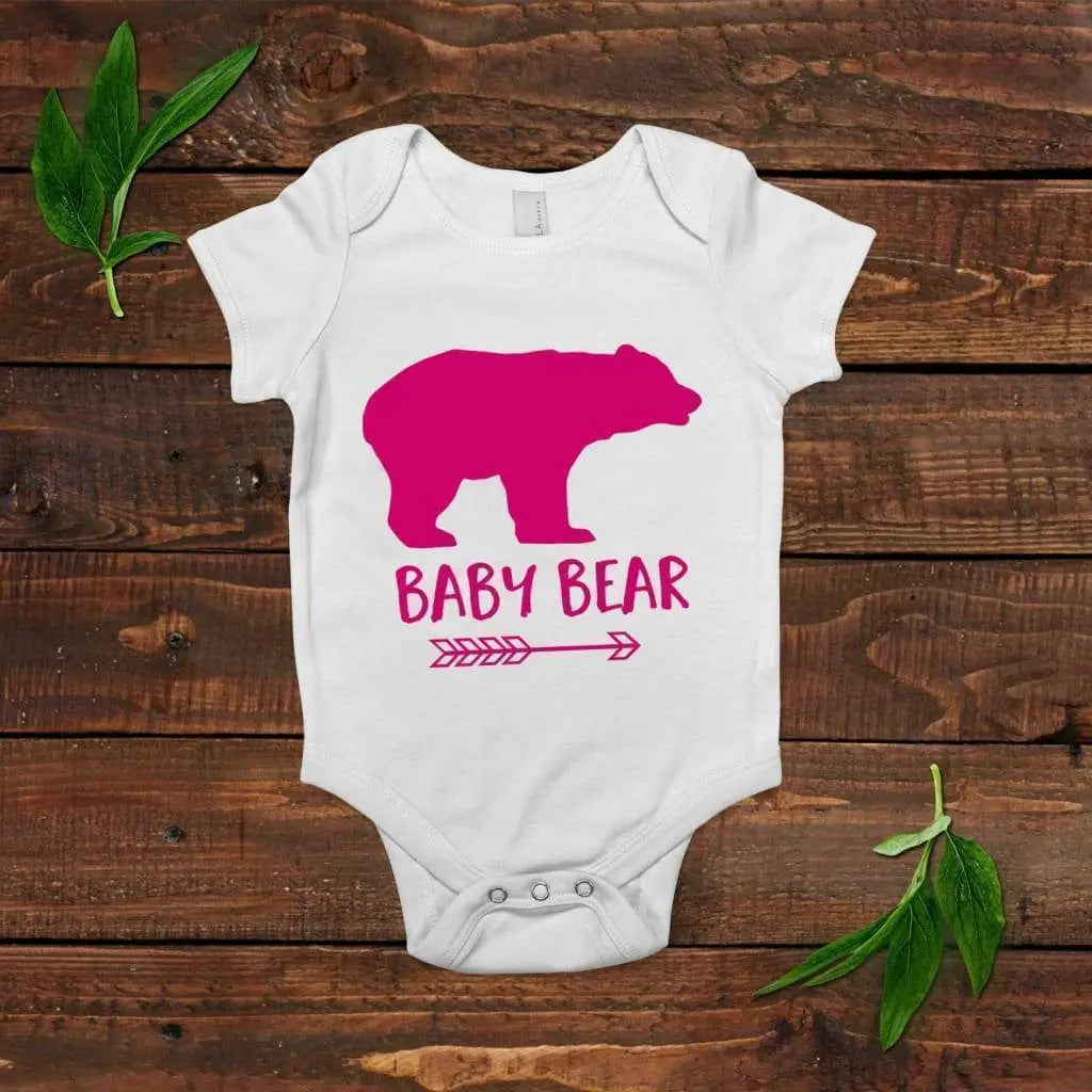 White short-sleeve onesie with pink bear graphic and snap closure