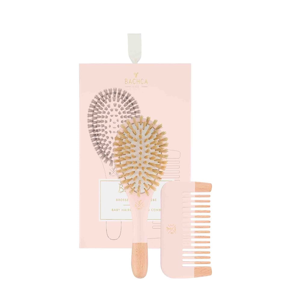 Pink baby hair brush set with round brush, paddle brush, and comb-like tool