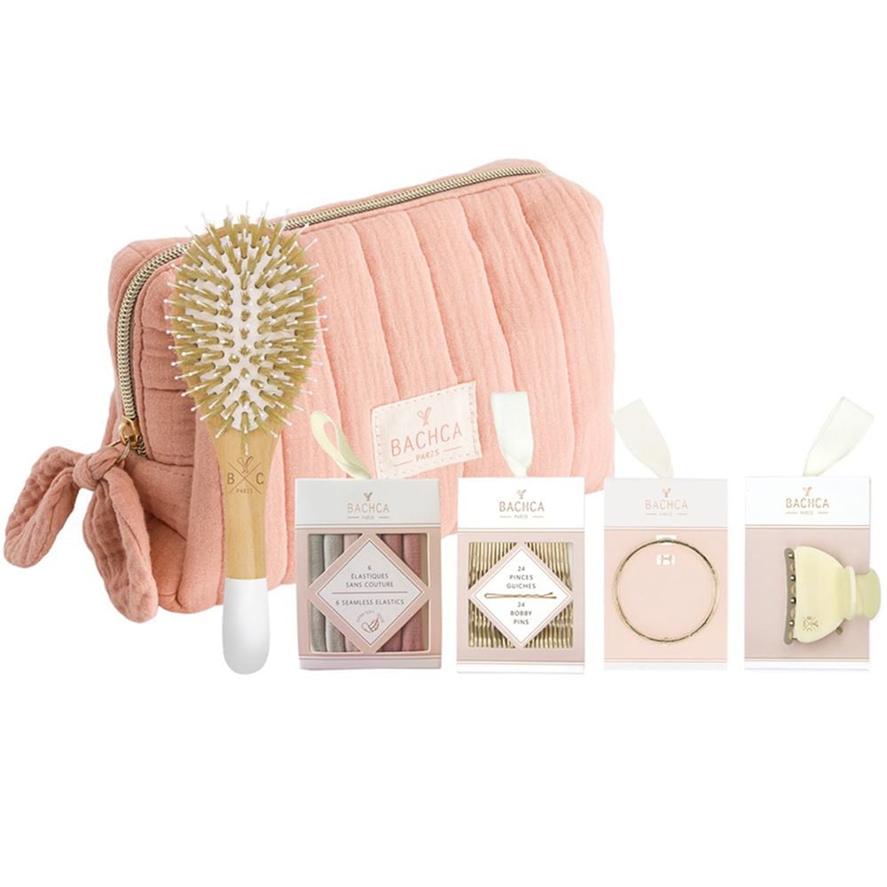 Pink bath accessory set with zip pouch, brush, and boxed accessories